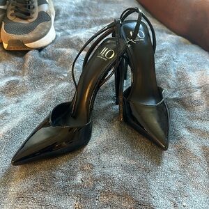 Shiny black pumps